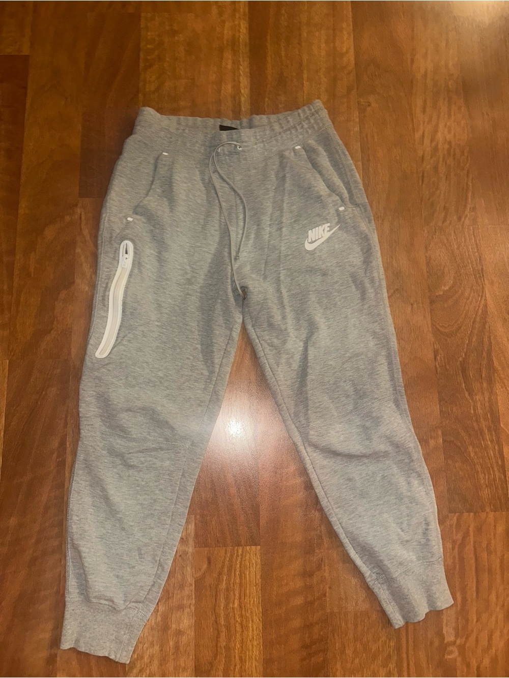 Nike Gray Fleece Jogger Pants with White Zip Accent